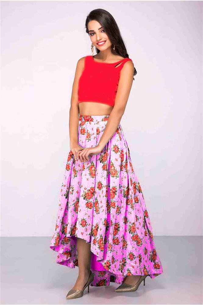 image of red and pink floral lehenga with a red crop top which has a boat neck and sleeveless design